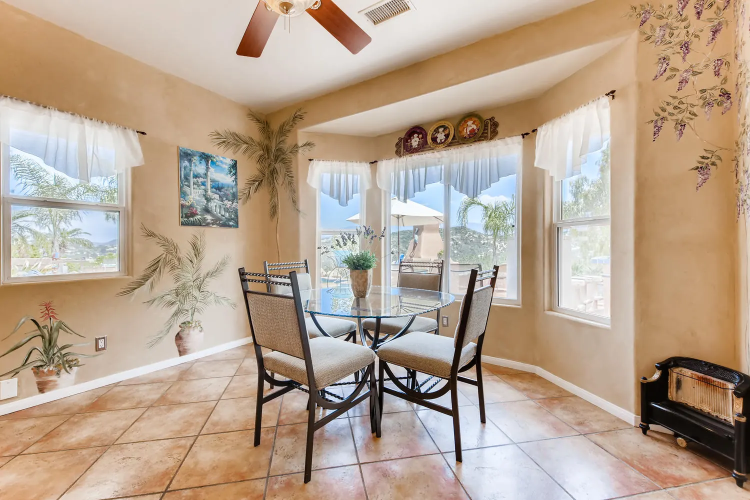 The breakfast area beside the kitchen windows