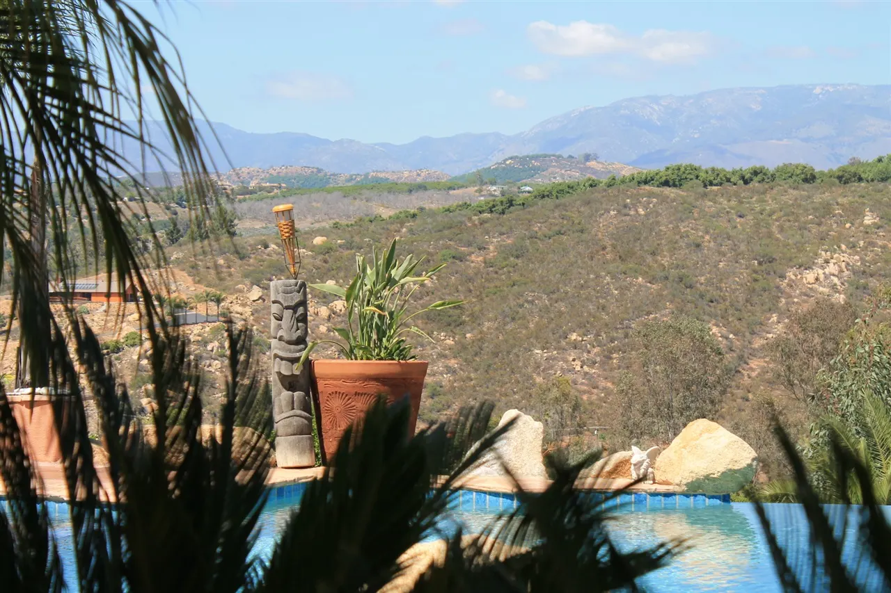 The infinity edge of the pool with the ridgeline in the distance